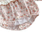 Blommig babybody med matchande hatt – söt och bekväm